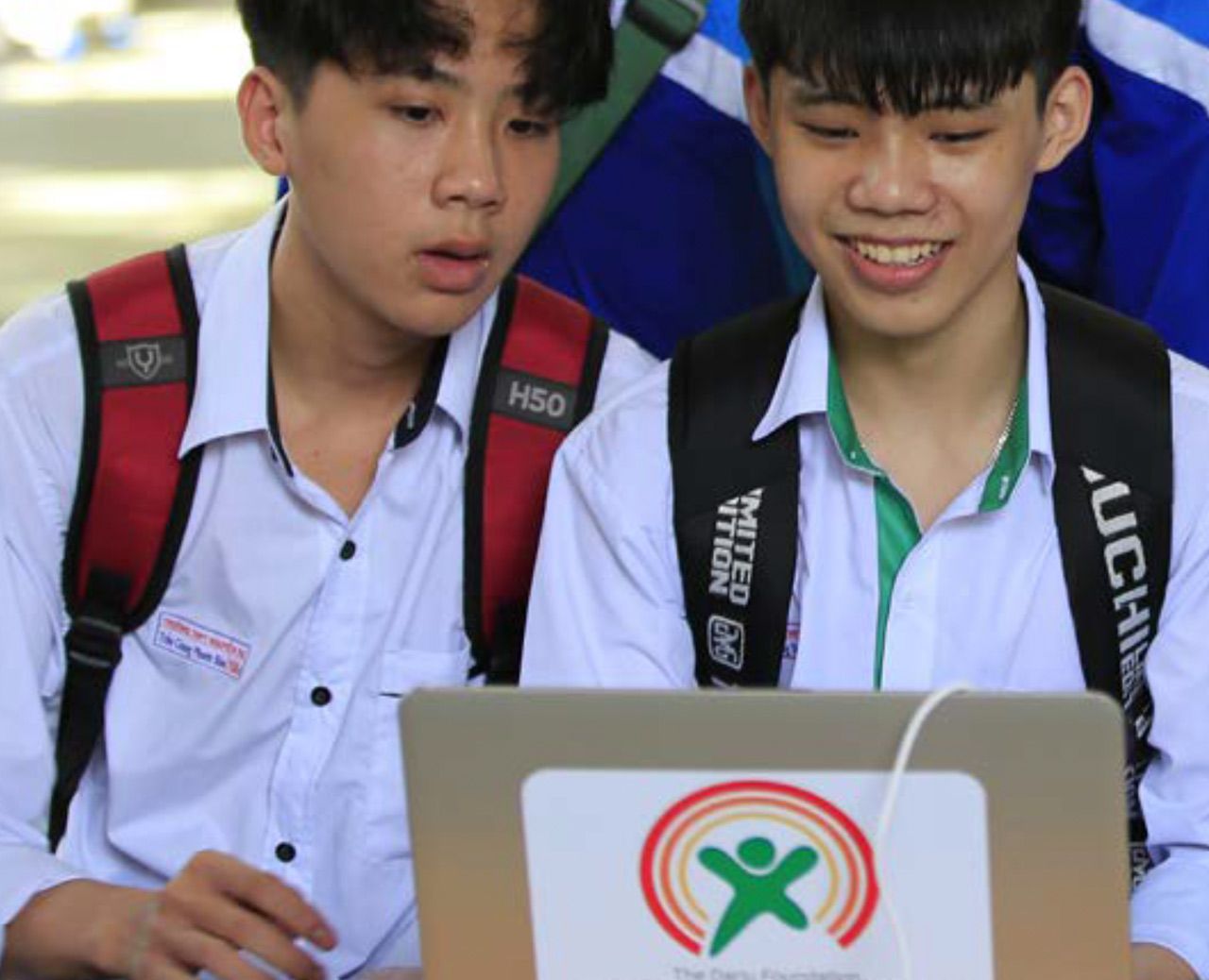 Two boys looking at a the laptop - Digital Literacy - Dariu Foundation