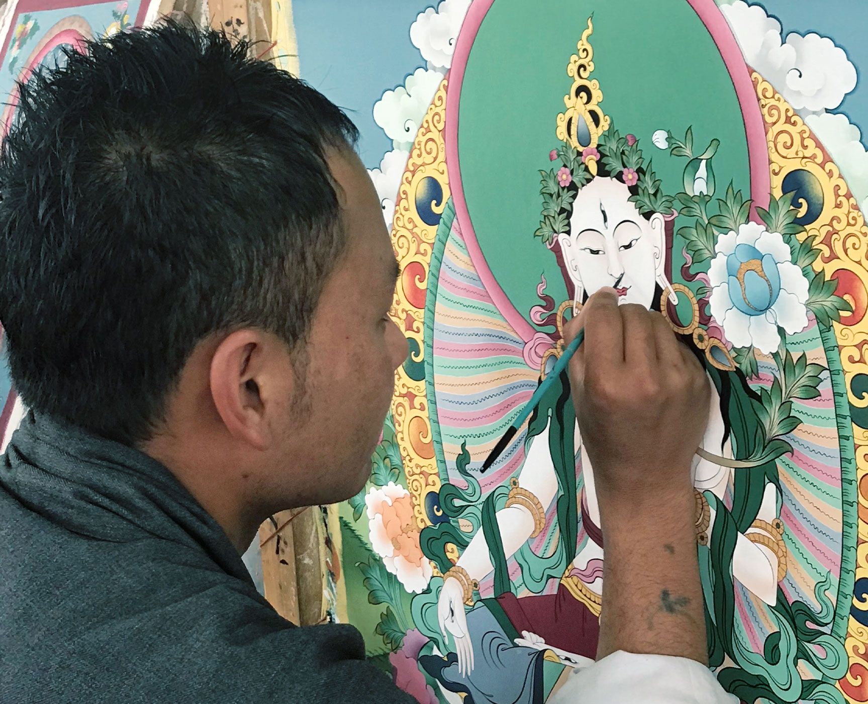 The Dariu Foundation - Bhutan - Man painting buddha